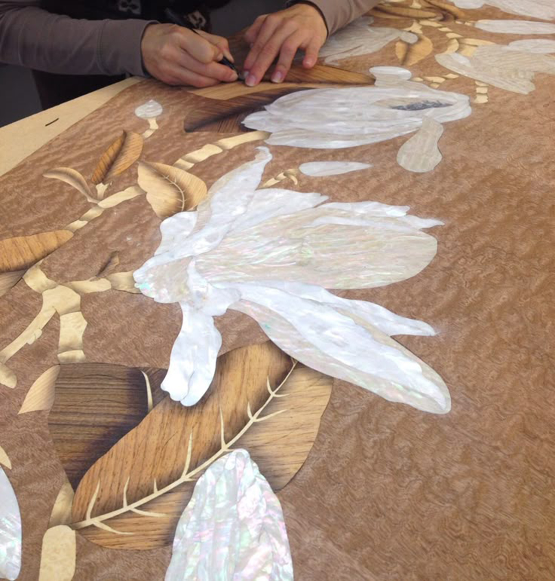 Hand-finished Indian craftsmanship in a luxury residential interior, including Makrana marble inlay and bespoke brass joinery, illustrating the craft tradition behind ultra-luxury Indian interior design 