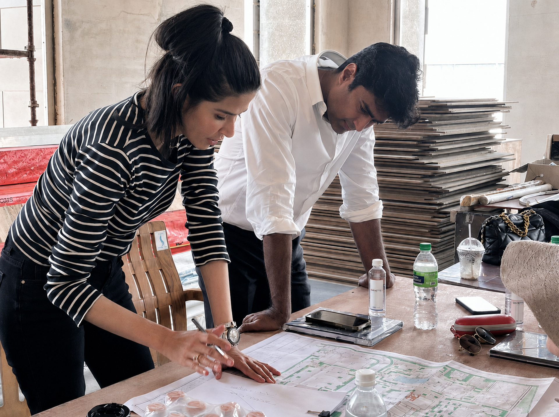Principal architect Aparna Kaushik reviewing architectural plans during the concept phase of an ultra-luxury Indian residential commission